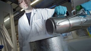 A chemist works with liquid nitrogen.